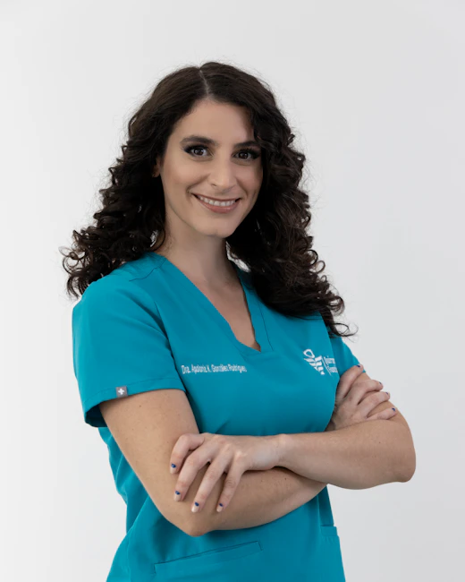 Clinic social post: doctor in teal scrubs smiling